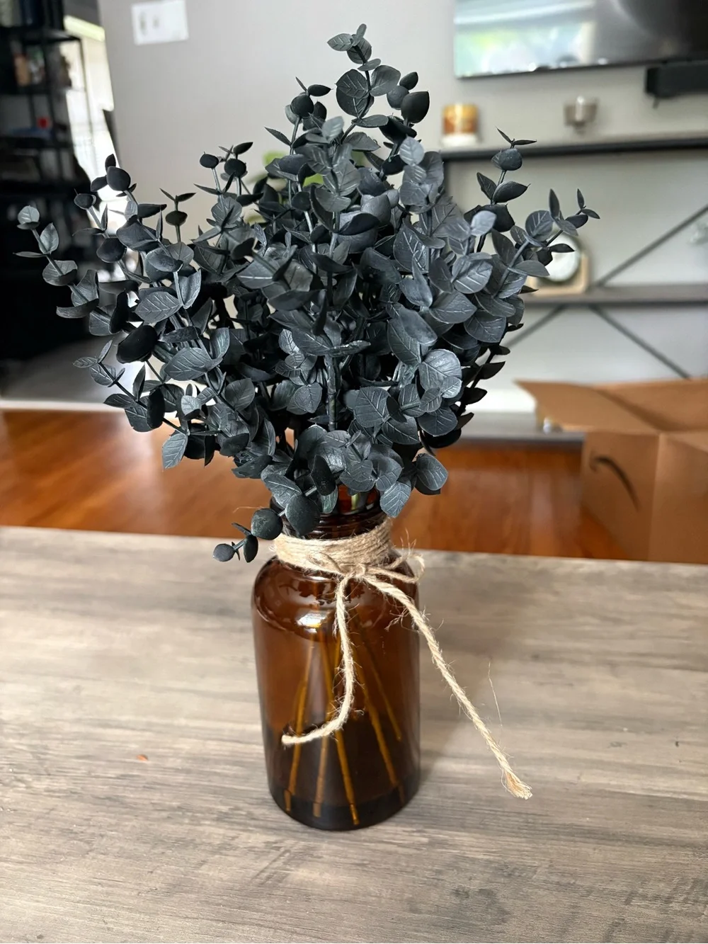 Black Faux Eucalyptus Stems in Amber Glass Vase